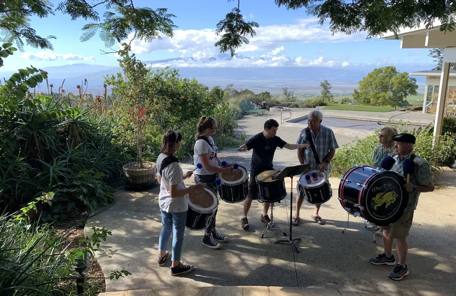 Drummers practicing on a patio